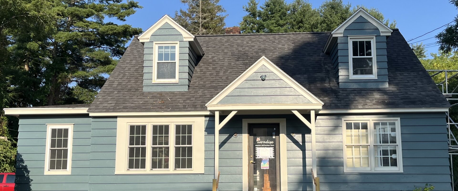 Blue cape cod style house