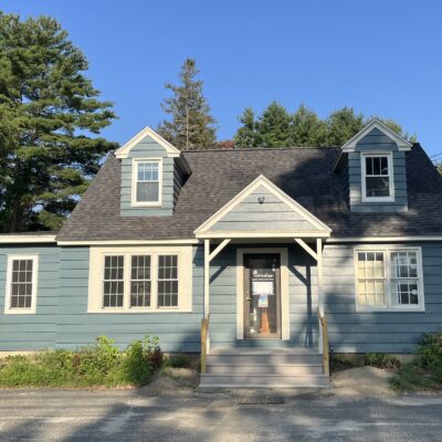 Blue cape cod style house