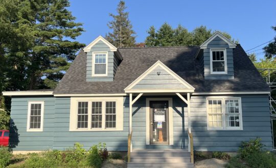 Blue cape cod style house